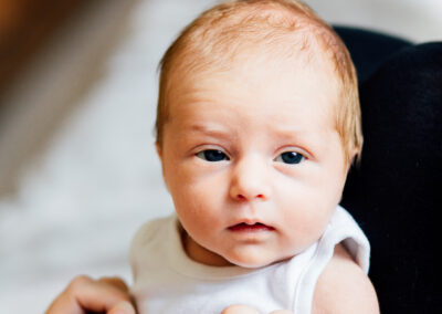 baby looking at camera with blue eyes